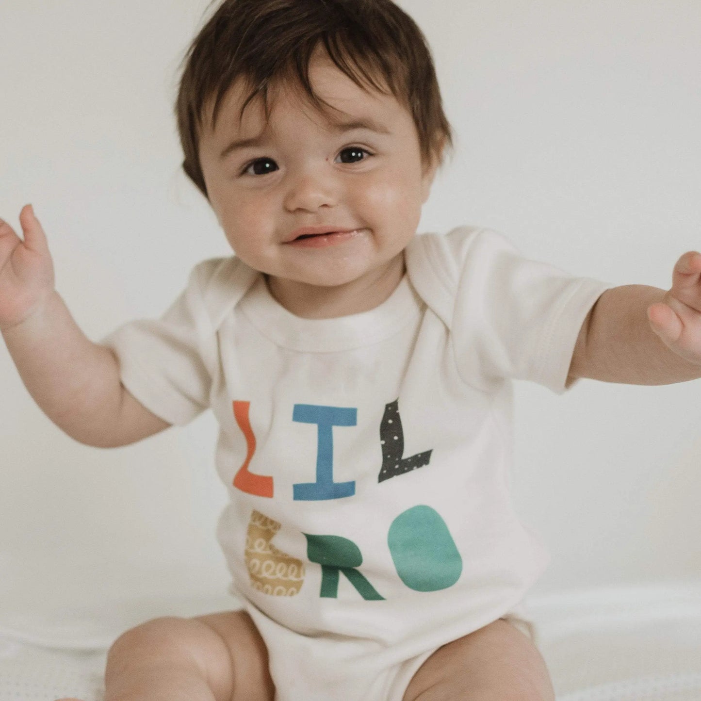 lil bro bright Baby graphic organic bodysuit Finn + Emma