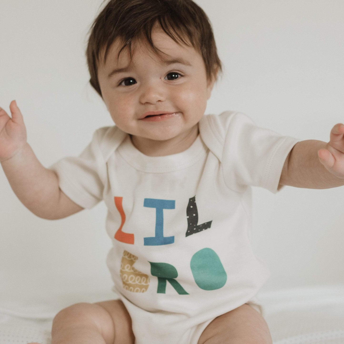 lil bro bright Baby graphic organic bodysuit